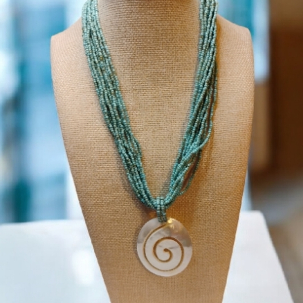 Statement Spiral Shell Pendant With Multiple Stra… - image 1